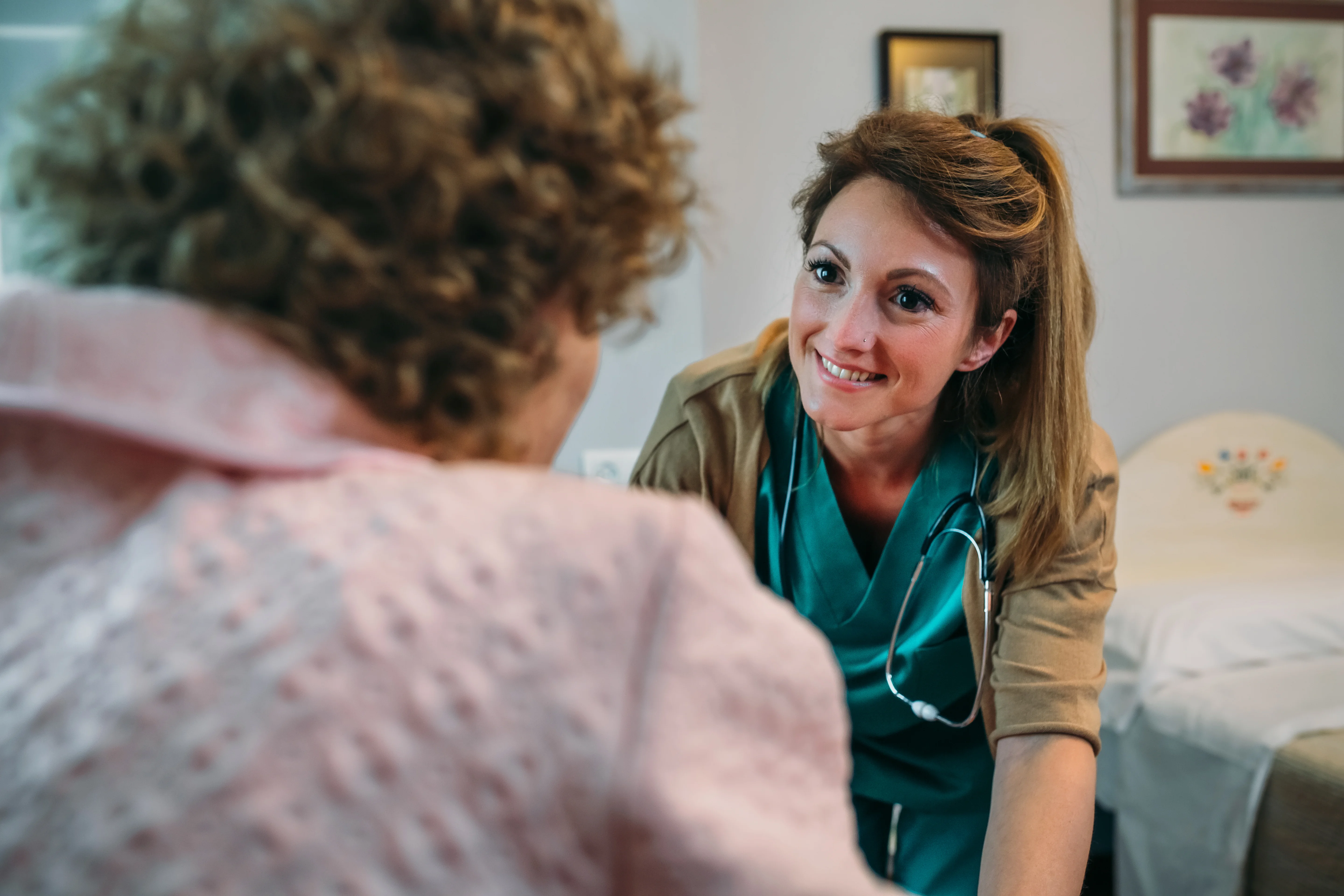 a nurse speaking to a patient