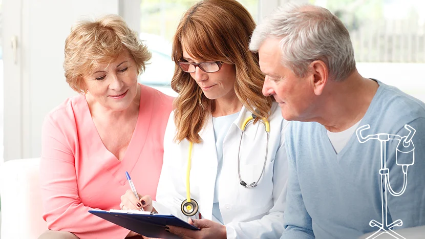 a doctor showing a man and a woman something on a tablet